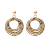 Lulu Lightweight Sparkly Gold Hoops on a Stud Earring